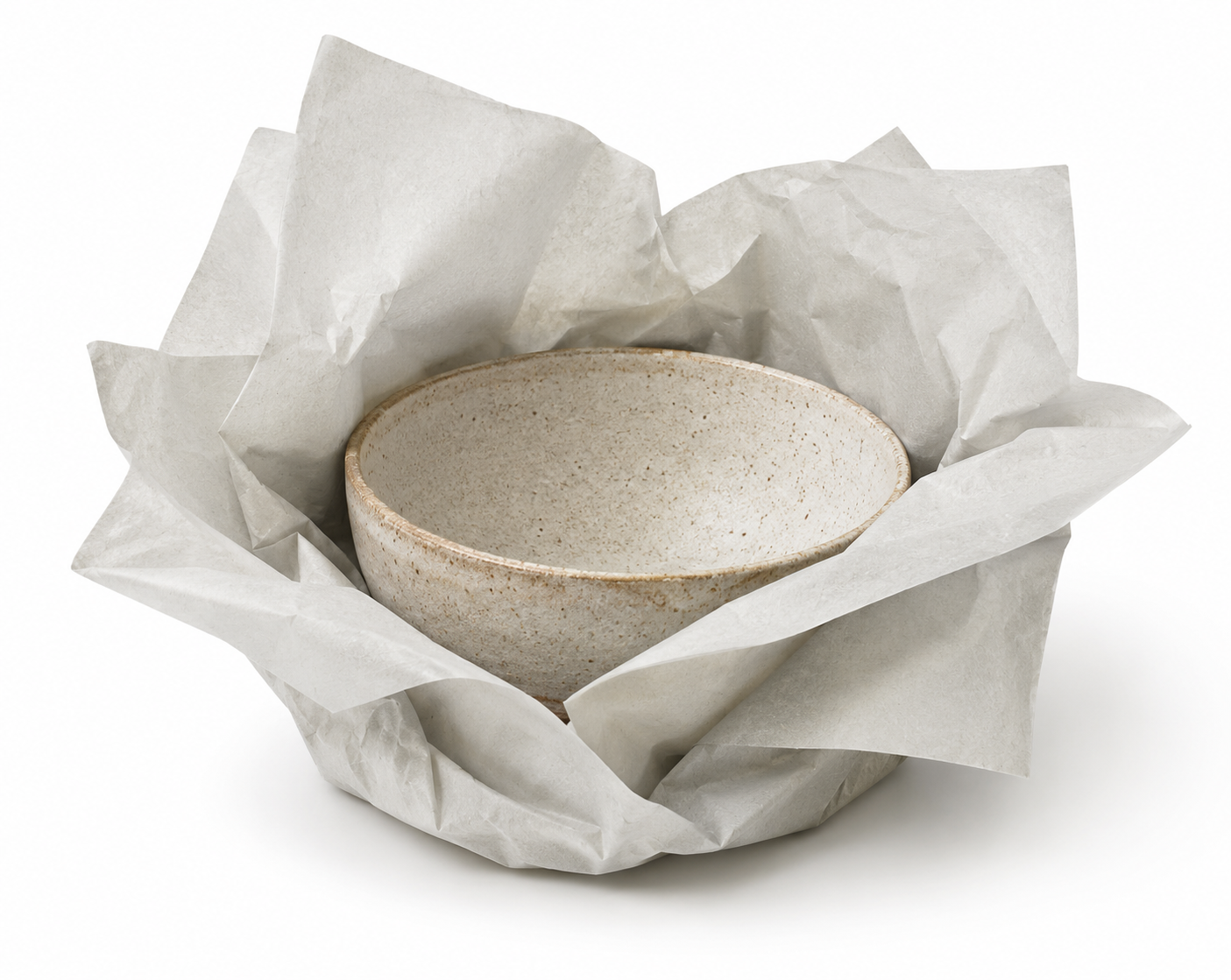Handmade ceramic bowl wrapped in recycled tissue paper