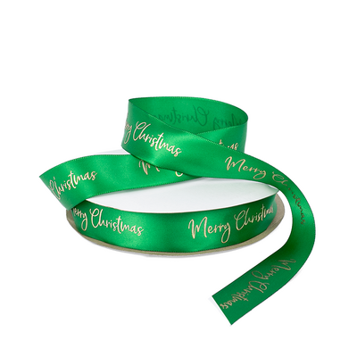 Gold Merry Christmas on Green Single Sided Satin Ribbon - Woven Edge 25mm x 45m